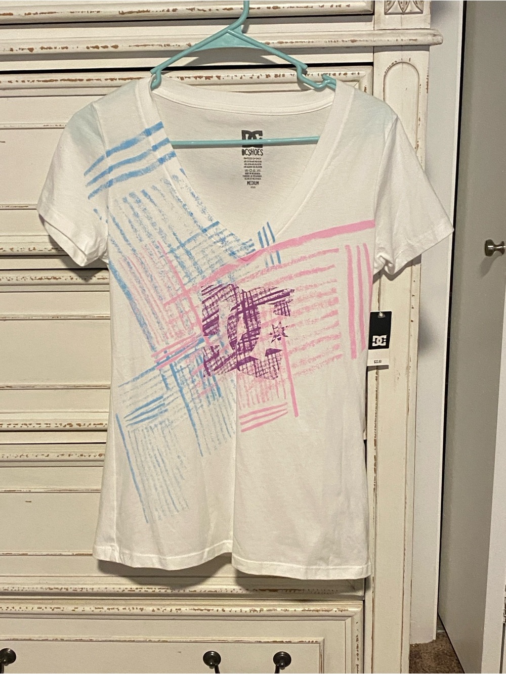 DC Women's White V‑Neck Tee with Pink & Light Blue Graphic